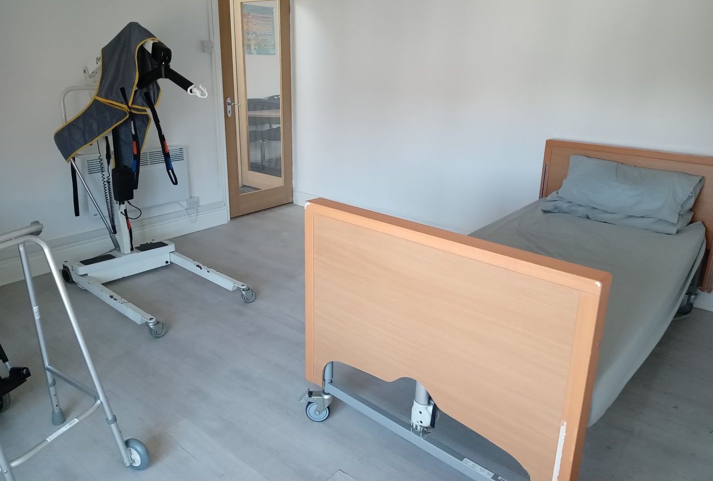 Practical skills room with profiling hospital bed and mobile hoist